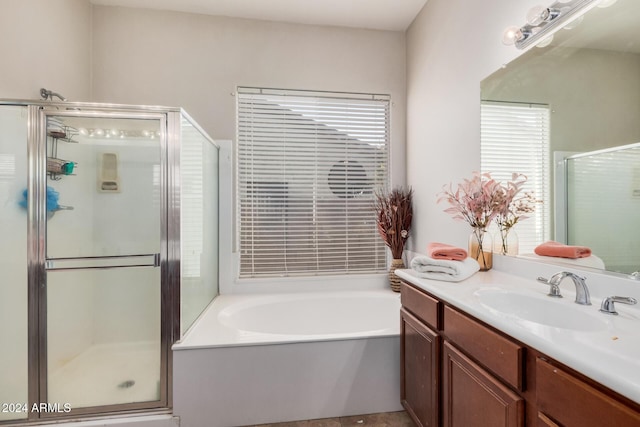 bathroom featuring vanity and plus walk in shower