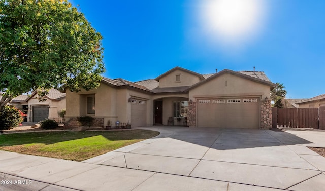 single story home with a front lawn and a garage