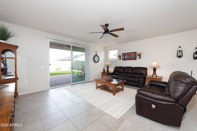 tiled living room featuring ceiling fan