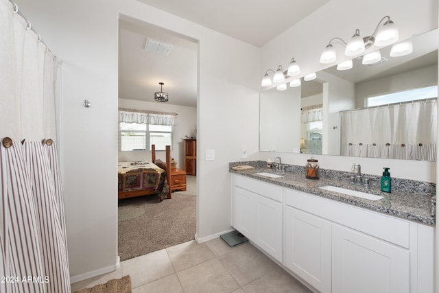 bathroom with tile patterned flooring and vanity