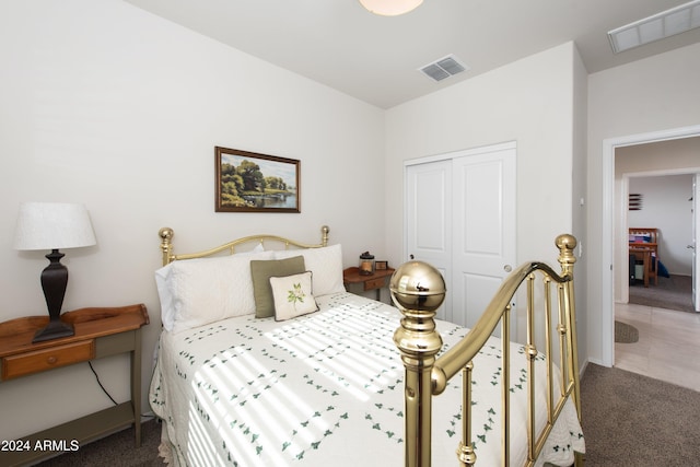 carpeted bedroom with a closet