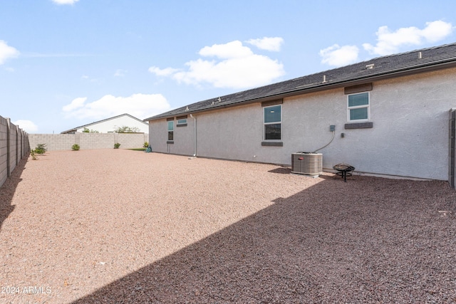 rear view of property featuring central AC unit