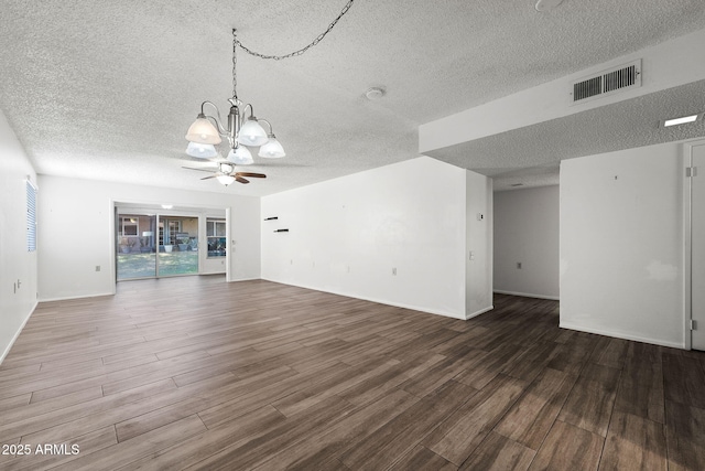 unfurnished living room featuring a ceiling fan, visible vents, a textured ceiling, and wood finished floors