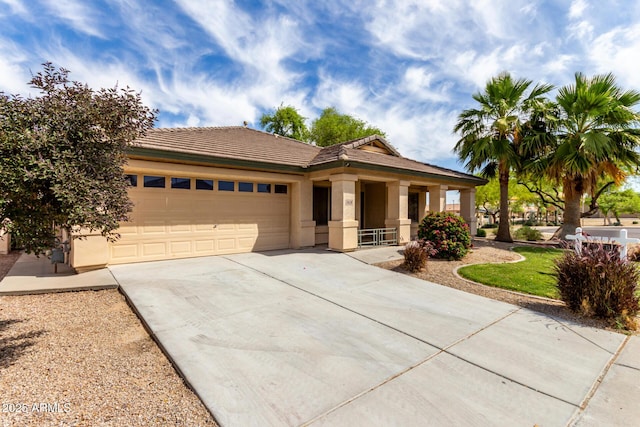 12428 W Vermont Ct, Litchfield Park, AZ 85340 - ranch-style house with a tiled roof, a garage, stucco siding, and driveway