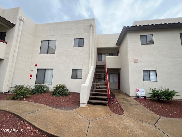 view of building exterior with stairway