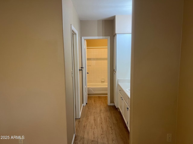 corridor with light wood finished floors