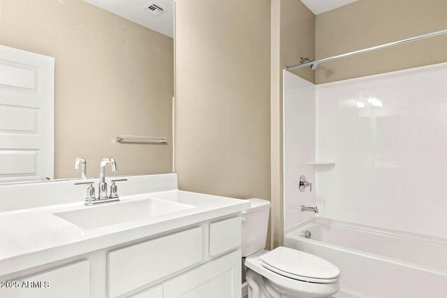 bathroom featuring visible vents, shower / bathtub combination, toilet, and vanity