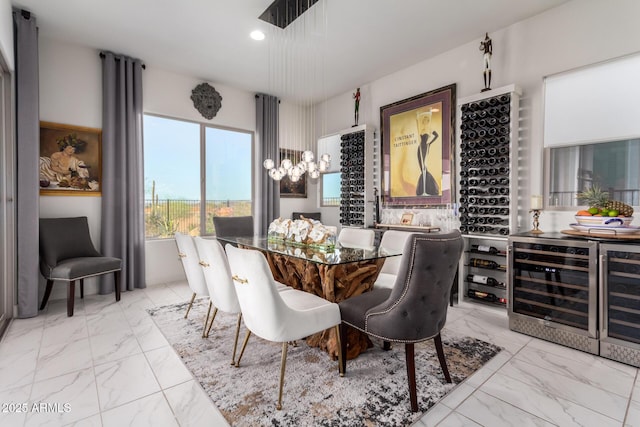 dining area featuring wine cooler, marble finish floor, and recessed lighting