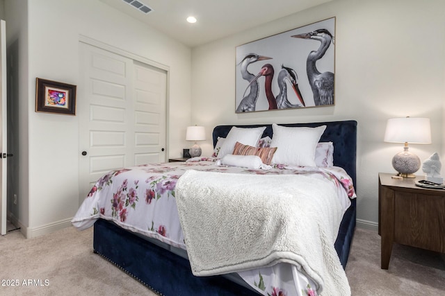 bedroom featuring recessed lighting, carpet flooring, visible vents, baseboards, and a closet