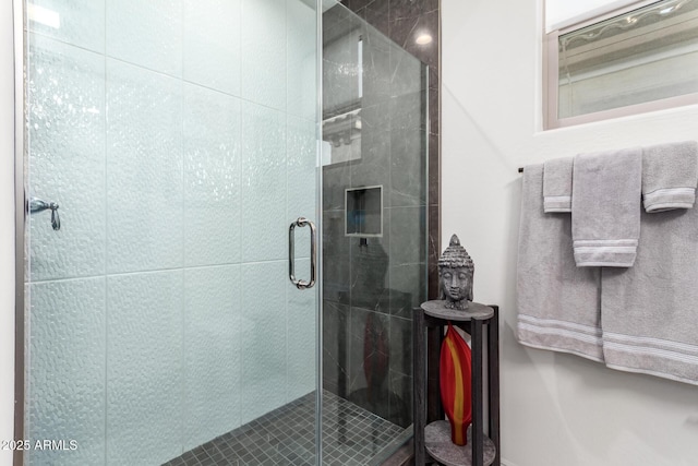 bathroom featuring a shower stall