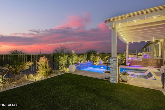 yard at dusk with a fenced backyard, a fenced in pool, and a hot tub