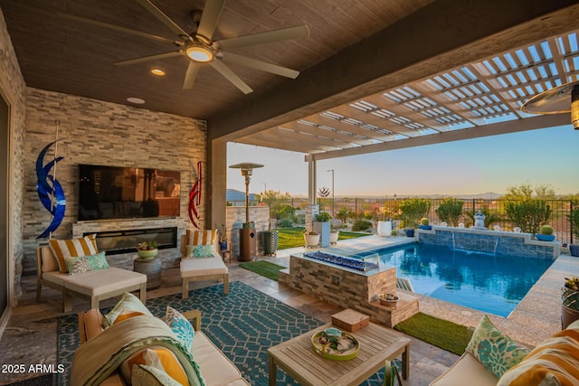 view of swimming pool with an outdoor living space with a fireplace, a patio area, fence, and a pergola