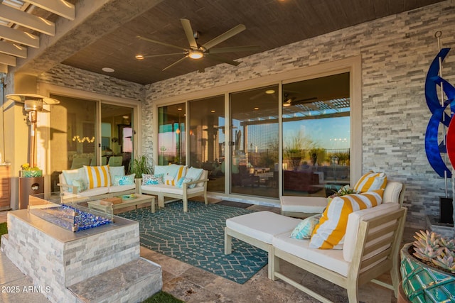 view of patio featuring a ceiling fan and an outdoor living space