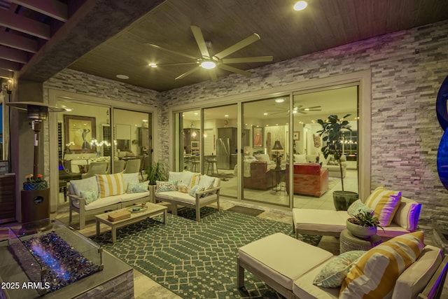 interior space with ceiling fan and an outdoor living space