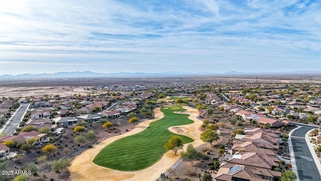 aerial view with a residential view, a mountain view, and golf course view