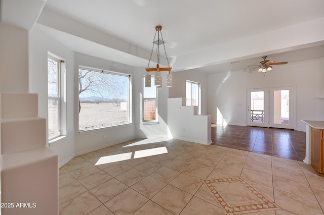 unfurnished dining area with light tile patterned flooring and ceiling fan