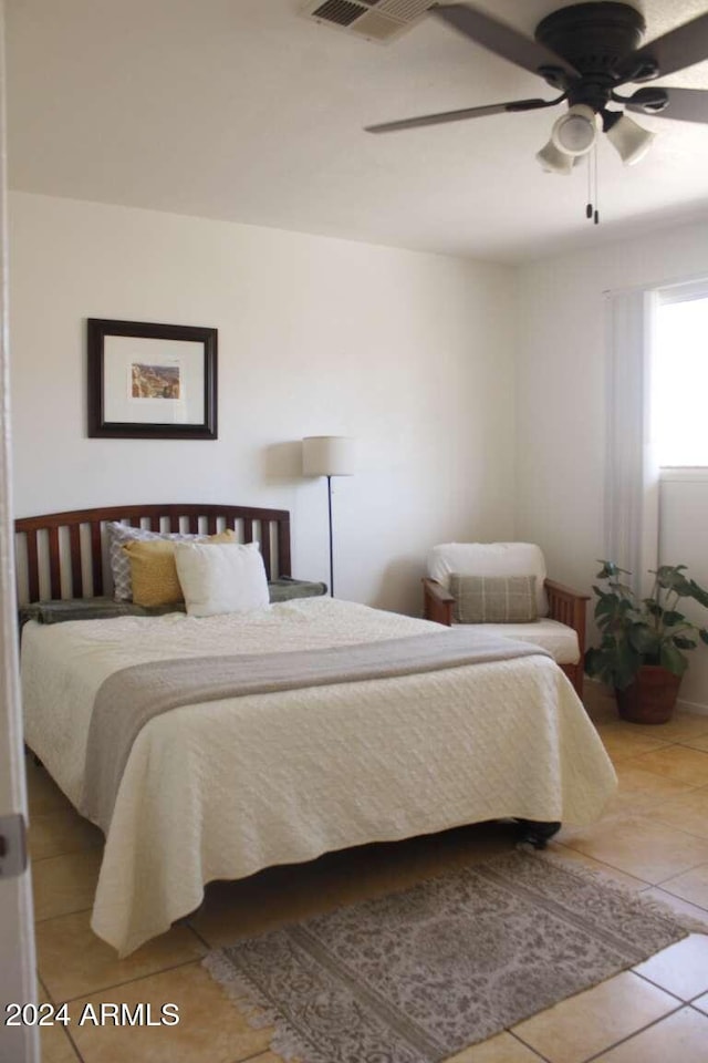 bedroom featuring ceiling fan and light tile patterned flooring