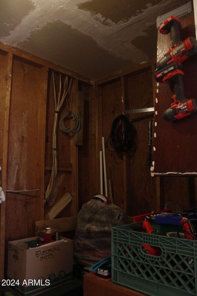 bedroom with wooden walls