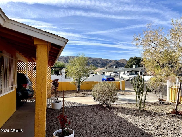 view of yard with a mountain view and a patio