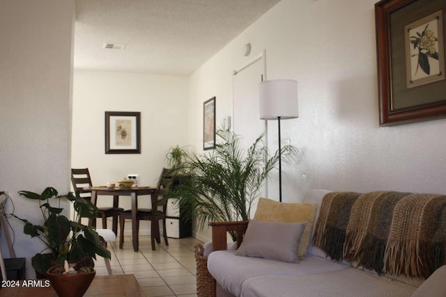 living area with light tile patterned floors