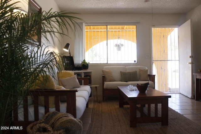 tiled living room with a textured ceiling