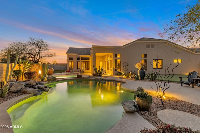 view of swimming pool with a fenced in pool, a patio, and fence