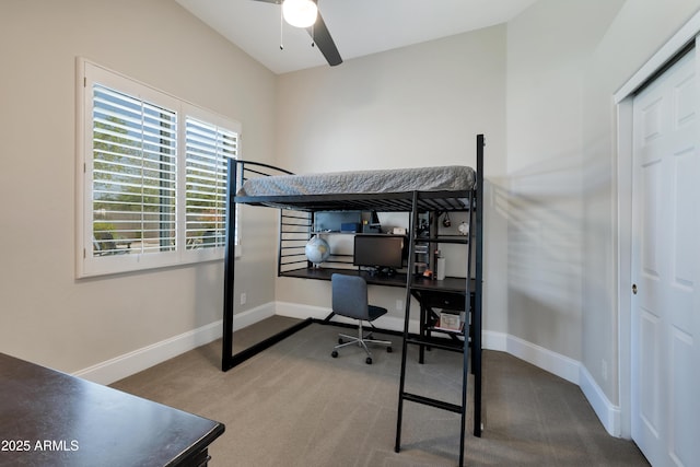 bedroom with carpet and baseboards