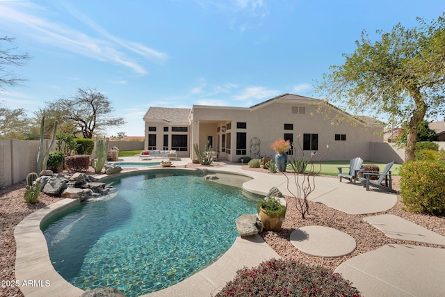 view of pool featuring a patio area, a fenced backyard, a sunroom, and a fenced in pool