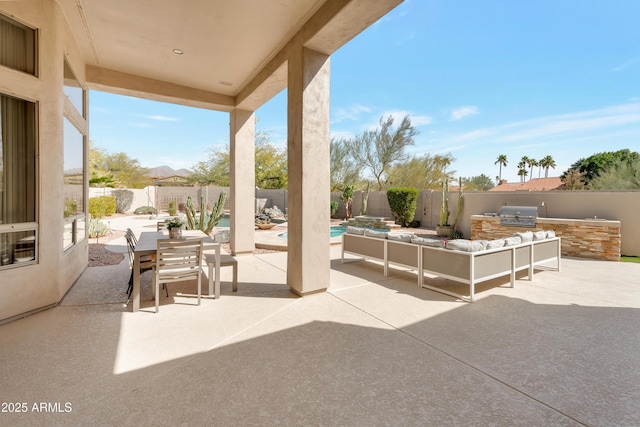 view of patio with a fenced in pool, outdoor dining area, a fenced backyard, and area for grilling