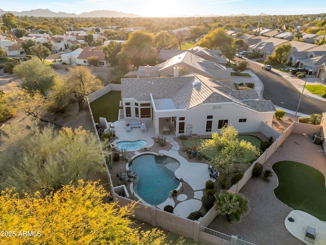 birds eye view of property with a residential view