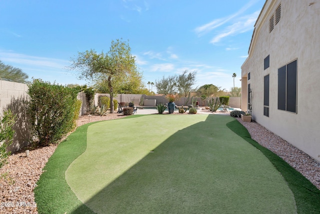 view of yard featuring a patio and a fenced backyard