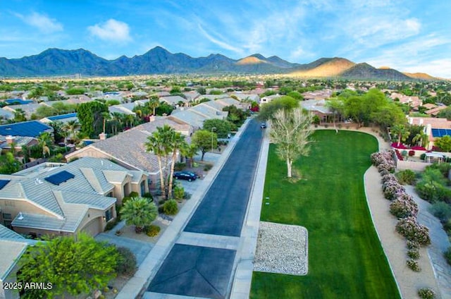 birds eye view of property with a residential view and a mountain view