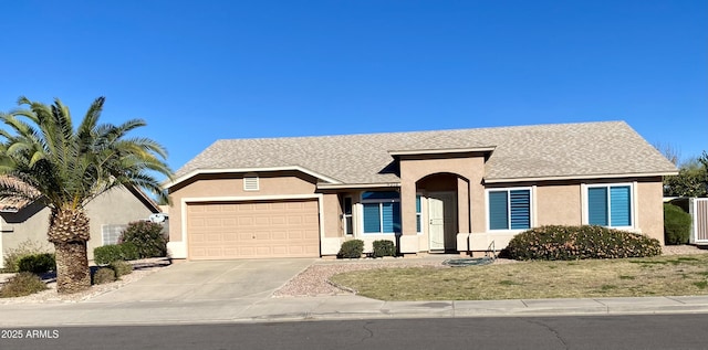 ranch-style home featuring concrete driveway, a shingled roof, an attached garage, and stucco siding