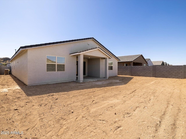 4812 W Hunter Trl, San Tan Valley, AZ 85144 - back of house with a patio area, a fenced backyard, central AC, and stucco siding