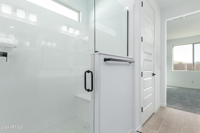 bathroom featuring tile patterned floors and walk in shower