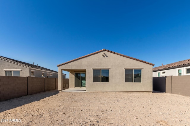 rear view of house featuring a patio