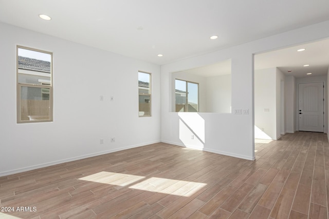 spare room featuring light hardwood / wood-style flooring