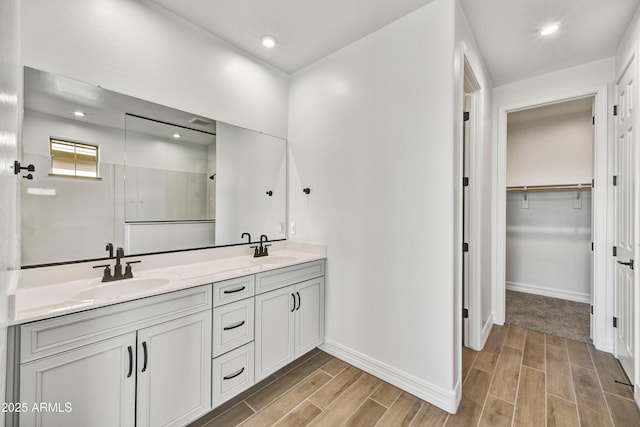 bathroom with vanity and walk in shower