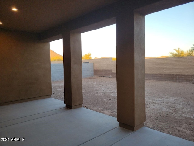 view of patio terrace at dusk