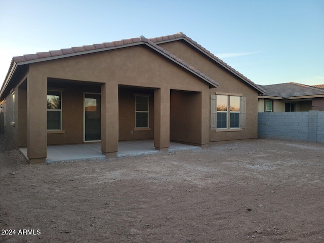 back of property featuring a patio area