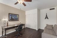 office space with ceiling fan and dark hardwood / wood-style flooring