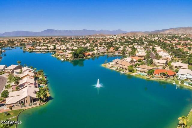 bird's eye view with a water and mountain view