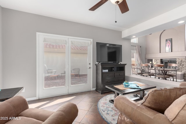 tiled living room featuring ceiling fan