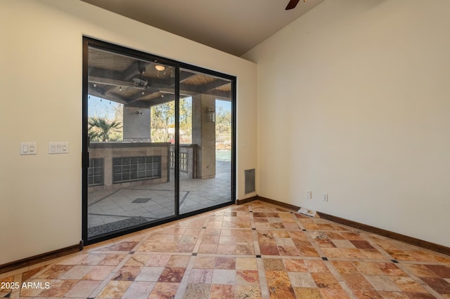 unfurnished room featuring ceiling fan and vaulted ceiling