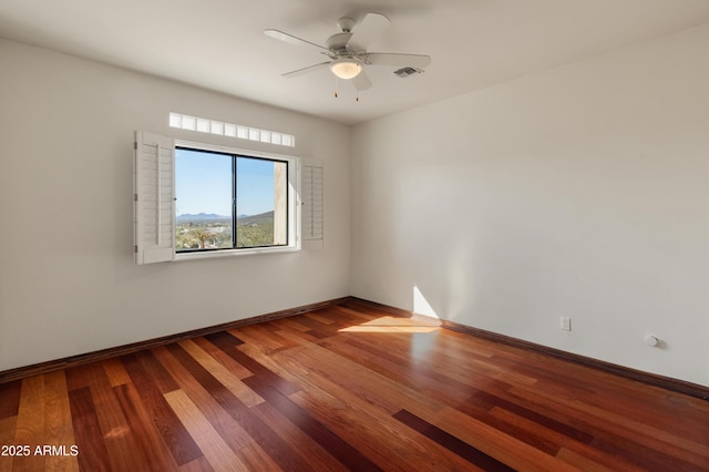 empty room with wood-type flooring and ceiling fan