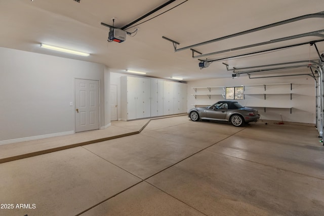 garage featuring a garage door opener