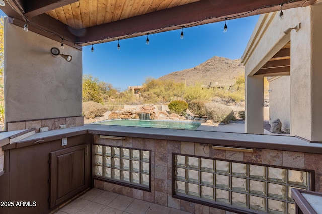 view of patio / terrace featuring a mountain view