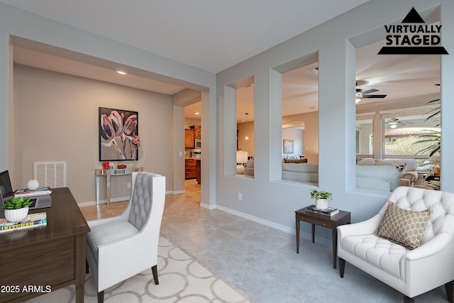 home office featuring a ceiling fan, visible vents, and baseboards