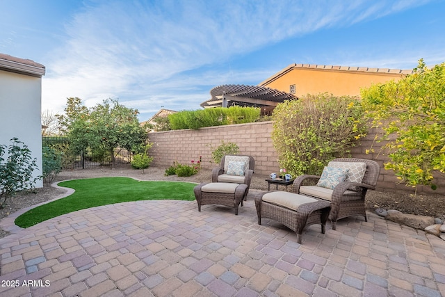 view of patio / terrace featuring a fenced backyard and a pergola