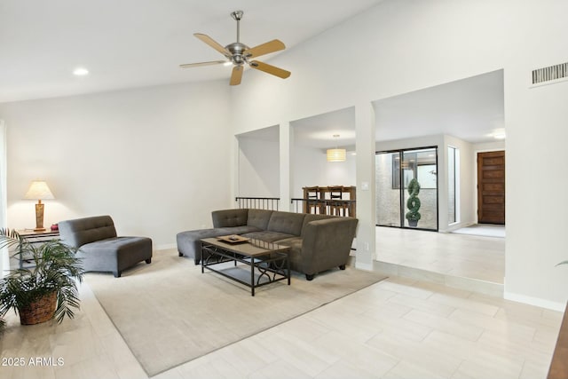 living room with ceiling fan and high vaulted ceiling